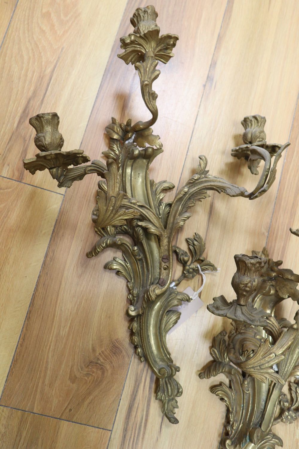 A pair of ormolu scrolled leaf wall sconces, height 54cm